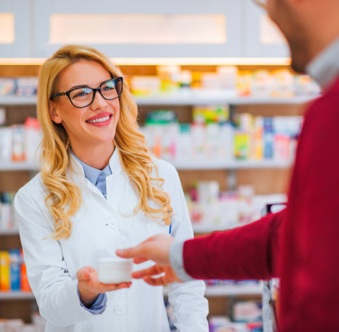 pharmacists smile at her patient