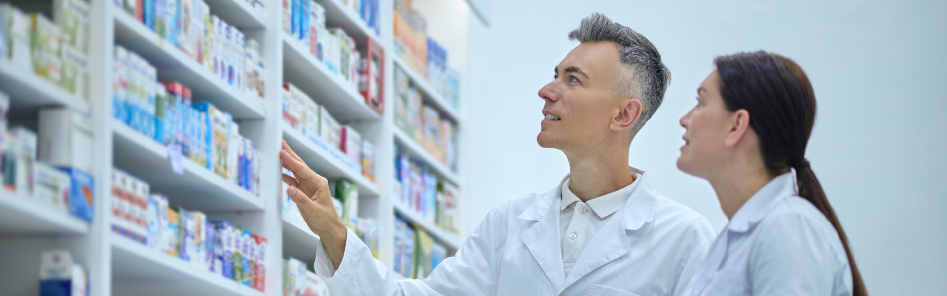two pharmacists look for a certain medicine