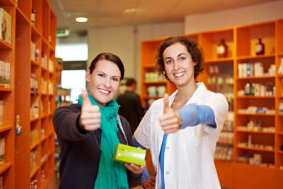 pharmacist and customer smile on the camera